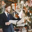 Guy in a black suit. Male at the restaurant.